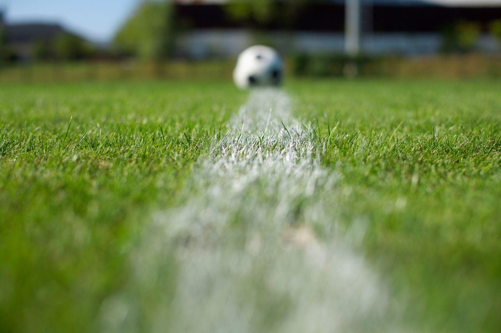 Soccer ball on a turf field with line markings