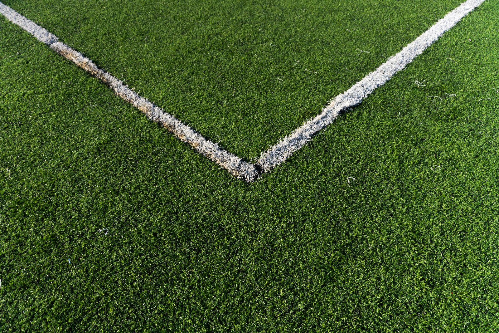 Soccer field corner with vibrant green artificial turf