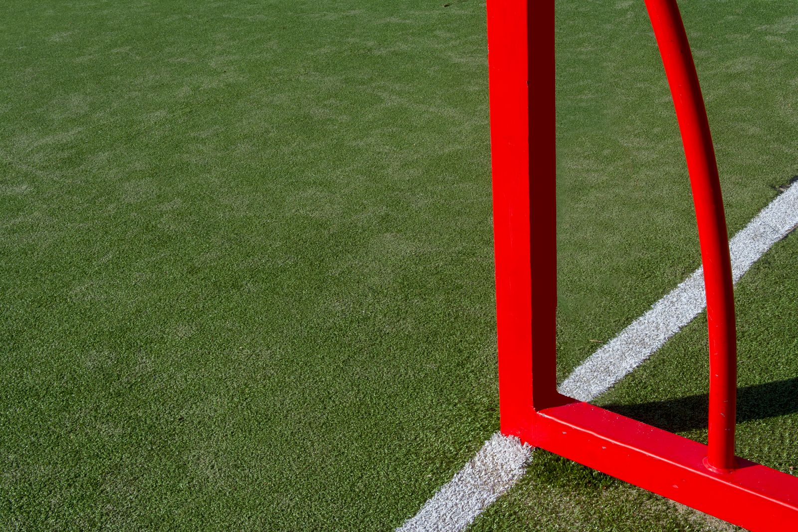 Soccer field corner with goalpost and turf line marking